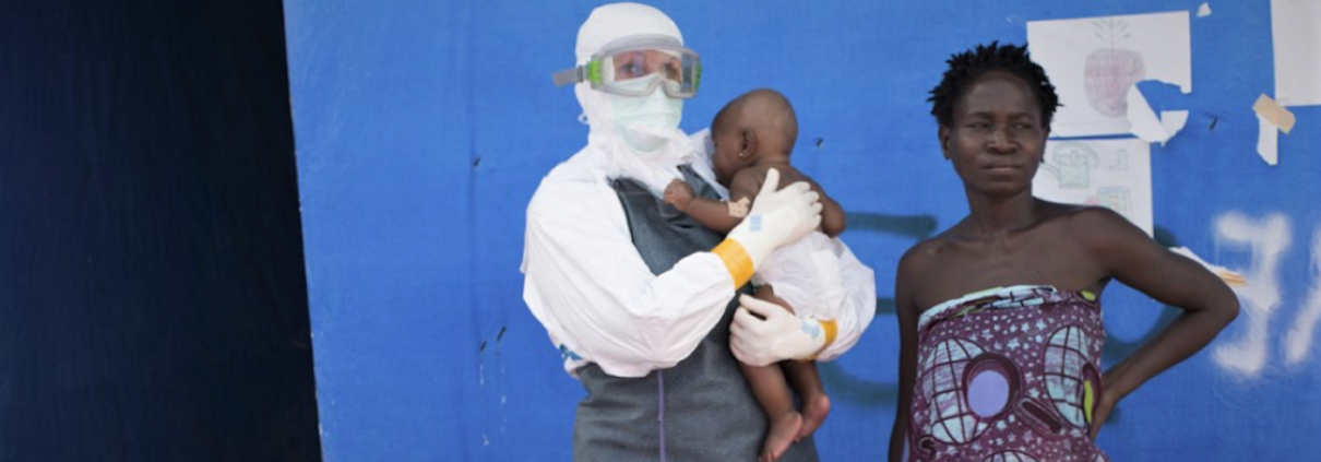 Jojo*, a young child who survived the 2014-2015 Ebola outbreak in Liberia, was cared for by health workers and her mother (right), also an Ebola survivor who was allowed to stay in the unit to care for her daughter.