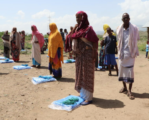 Ethiopian internally-displaced persons practicing social distancing while receiving shelter kits in a small rural village in the Erer district of the Somali Region, Ethiopia. Image credit: Seifu Asseged / Save the Children