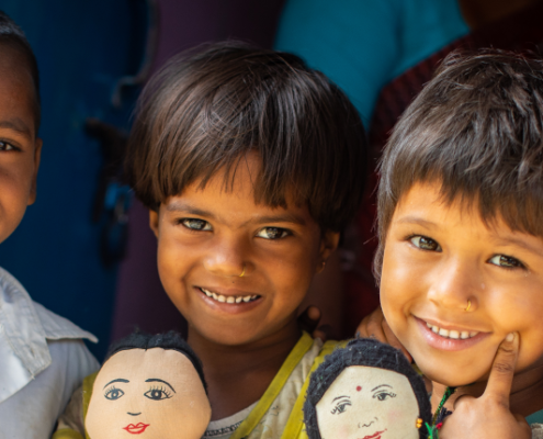 4-year-olds Krishna, left, Roshni, center left and 5-year-olds Barsha, center right, and Nitesh stand outside of their early learning center on Sunday, April 29 in Saptari, Nepal.