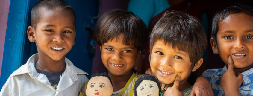 4-year-olds Krishna, left, Roshni, center left and 5-year-olds Barsha, center right, and Nitesh stand outside of their early learning center on Sunday, April 29 in Saptari, Nepal.