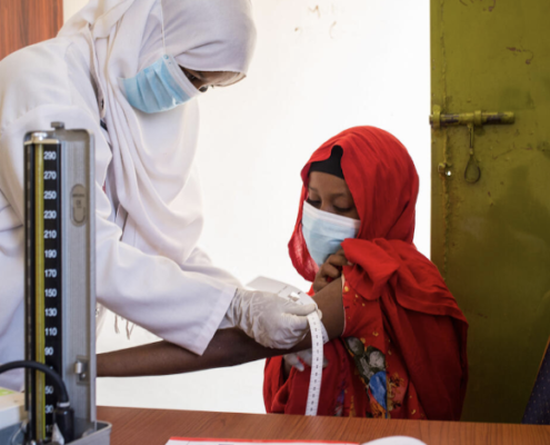 Faduma*, 16 receives a vaccination & health check - Burao, Somalia. Image credit: Mustafa Saeed / Save the Children