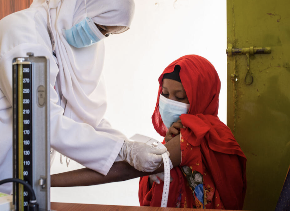 Faduma*, 16 receives a vaccination & health check - Burao, Somalia. Image credit: Mustafa Saeed / Save the Children