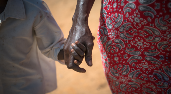 Josephine, 9 years old, walking with her mother Celina in Lodwar, Kenya. (Image credit: Allan Gichigi / Save the Children)