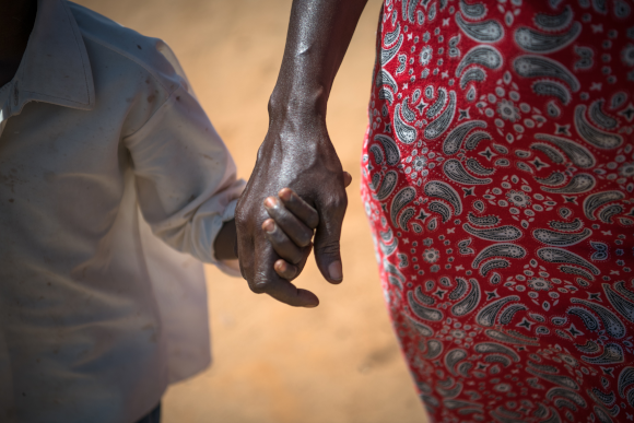 Josephine, 9 years old, walking with her mother Celina in Lodwar, Kenya. (Image credit: Allan Gichigi / Save the Children)