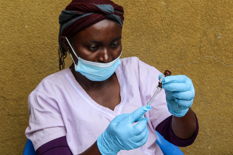 CH1633427_Mpartoke, 41, prepares a measles vaccine during a campaign supported by Save the Children's Emergency Health Unit